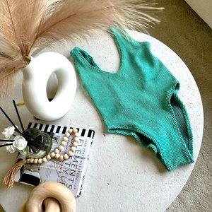 Highly popular BOND-EYE One piece. Aqua with hints of Gold.